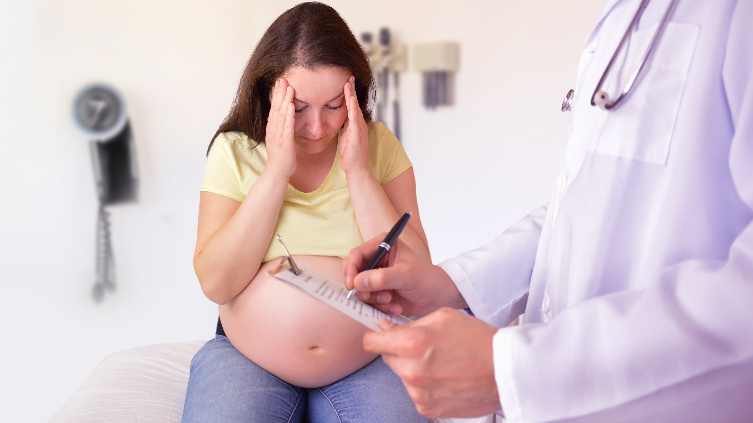 Stressed pregnant woman at the doctors