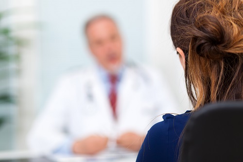 woman talking to doctor