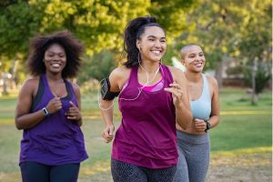 Three young women running in exercise clothes